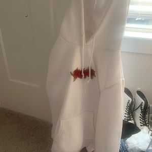 White hoodie with rose print along the chest!